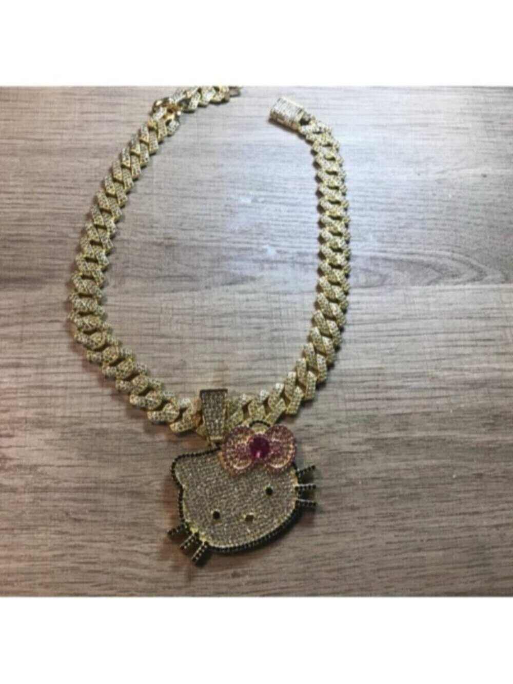Hello Kitty Gold-Tone Rhinestone Pendant Necklace with Pink Bow